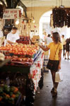 Woman Looking at Fruit in French Market (NewOrleansOnline.com, David Richmond)